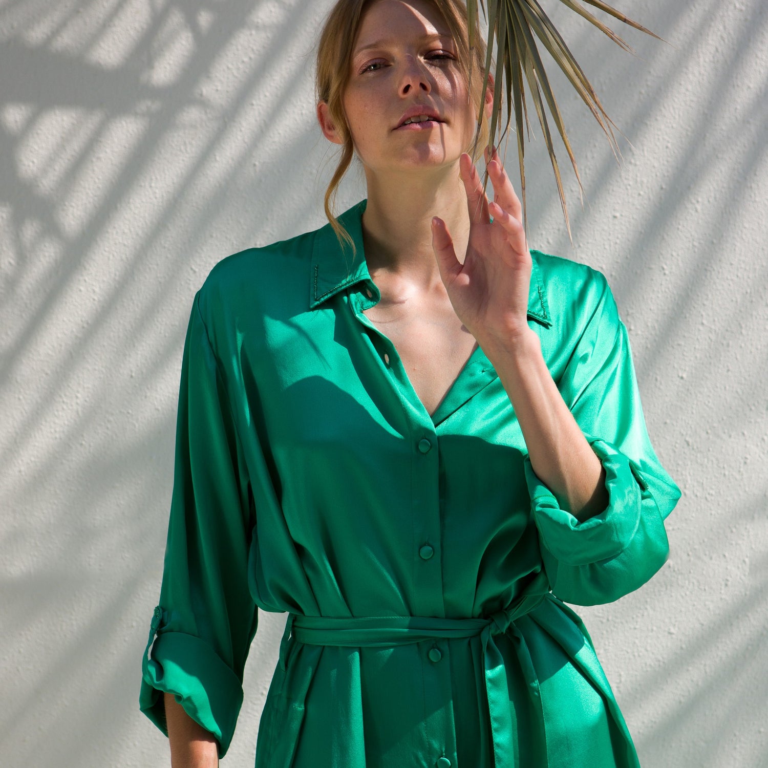 Flowing silk dress designed for one-size-fits-all in mint color.